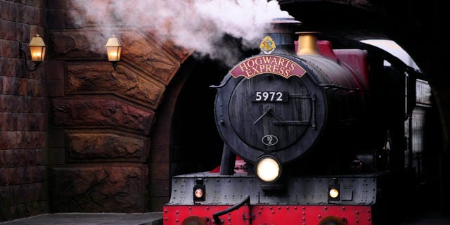The Hogwarts Express train, which connects the Universal Studios with neighboring Islands of Adventure, pulls into the Hogsmeade Station during a media preview for The Wizarding World of Harry Potter-Diagon Alley at the Universal Orlando Resort in Orlando, Florida June 19, 2014.