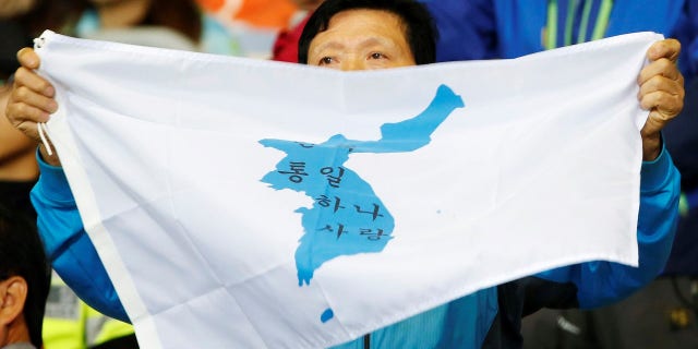 The unification flag will be waved instead of the South Korea flag in the opening ceremony.