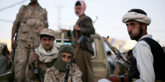 In this January 2015 photo, Houthi fighters patrol a road in Yemen's capital Sana'a. After the group took over the capital in September 2014, a Saudi-led coalition, backed by the U.S., intervened on behalf of the Yemini government.