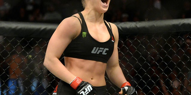 Feb 28, 2015; Los Angeles, CA, USA; Ronda Rousey (red gloves) reacts after defeating Cat Zingano (not pictured) during their women's bantamweight title bout at UFC 184 at Staples Center. Rousey won in 14 seconds of the first round. Mandatory Credit: Jayne Kamin-Oncea-USA TODAY Sports - RTR4RL9J
