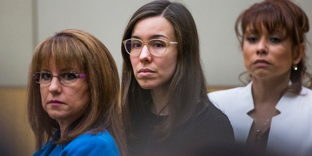 Jodi Arias, center, watches the jury enter the courtroom for her sentencing phase retrial in Phoenix, March 5, 2015.