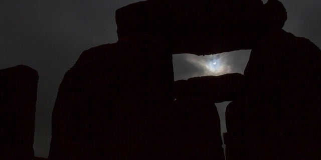 File photo: The solar eclipse is seen over Stonehenge on Salisbury Plain, Salisbury, southern England March 20, 2015. (REUTERS/Kieran Doherty)