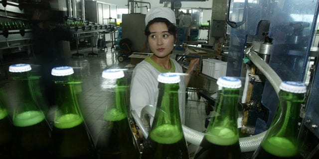 North Korean women work at the Taedonggang Beer factory in 2008.