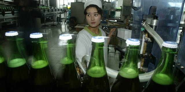 North Korean women work at the Taedonggang Beer factory in 2008.