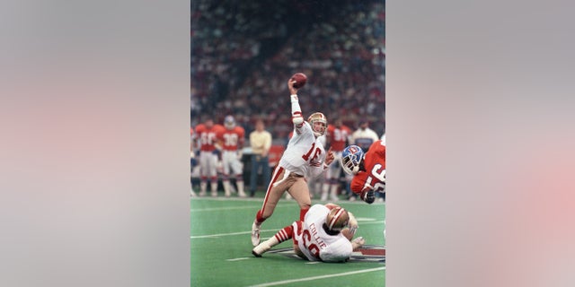San Francisco quarterback Joe Montana scrambles for yardage during the first quarter of Super Bowl XXIV on January 28, 1990.