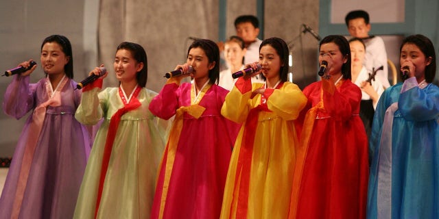 North Korea's cheering squad sings at 2005 Asian Athletics Championships in Incheon, South Korea.