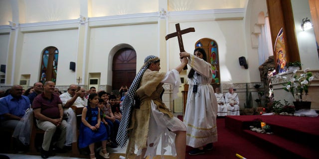 Iraqi Christians attend an Easter celebration at St.George Chaldean Church in Baghdad, Iraq April 15, 2017.