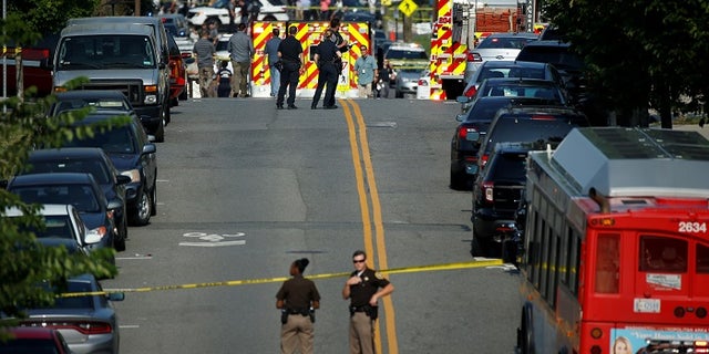 Police man a shooting scene after a gunman opened fire on Republican members of Congress during a baseball practice near Washington in Alexandria, Virginia, June 14, 2017. REUTERS/Joshua Roberts - RTS171O5