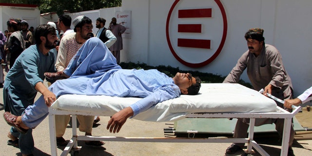 A man is transported to a hospital on a gurney after a car bomb attack in Lashkar Gah, Helmand province, Afghanistan June 22, 2017. REUTERS/Abdul Malik - RTS1869X