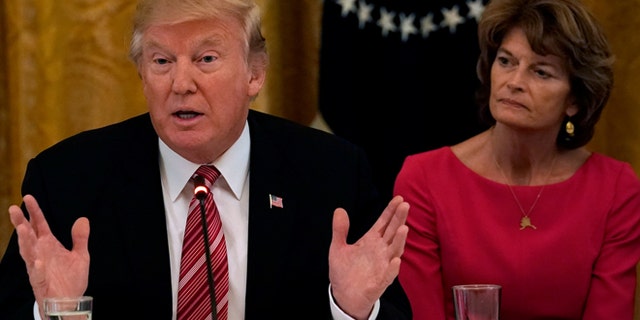 President Trump with Alaska Sen. Lisa Murkowski in June. Fellow Alaska Sen. Dan Sullivan said he and Murkowski told Trump not to rename Denali.