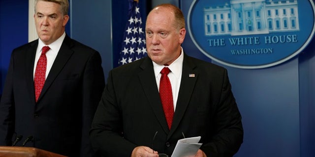 Thomas Homan (R), acting director of the Immigration and Customs Enforcement Agency (ICE), and U.S. Attorney for Utah John Huber hold a briefing at the White House in Washington, U.S., June 28, 2017. REUTERS/Yuri Gripas - RTS190OW