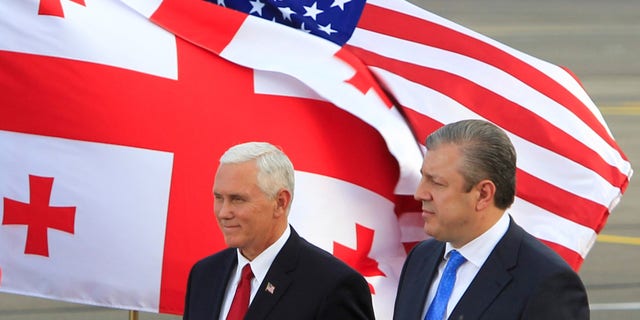 FILE -- Vice President Mike Pence and Georgian Prime Minister Georgi Kvirikashvili attend a welcoming ceremony at the Tbilisi International Airport, Georgia July 31, 2017.