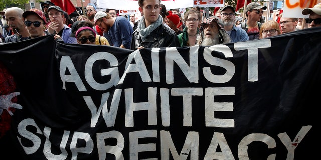 A group of counter-protesters rally against members of white nationalists in Charlottesville, Virginia, on Saturday, Aug. 12, 2017.