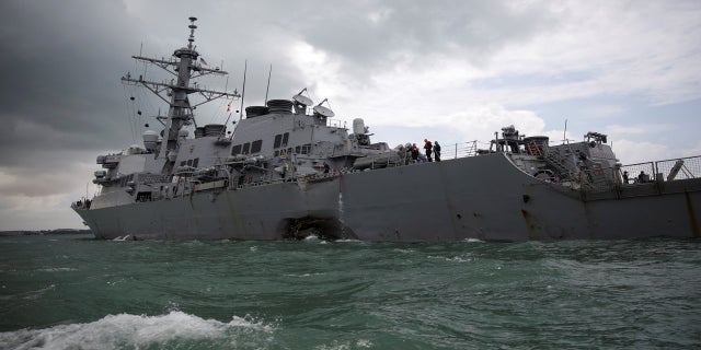 The U.S. Navy guided-missile destroyer USS John S. McCain is seen after a collision, in Singapore waters, Aug. 21, 2017.