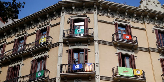 Pro-independence "Yes" banners adorn an apartment block ahead of a banned referendum on independence from Spain in Barcelona, Spain September 29, 2017.