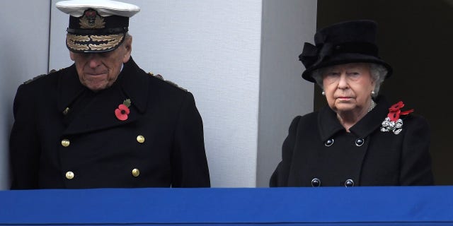 Queen Elizabeth II and Prince Philip, Duke of Edinburgh stand in silence at the Remembrance Sunday Cenotaph service in London, Britain, November 12, 2017.