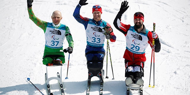 Gold medallist Daniel Cnossen (33) of the U.S., silver medallist Dzmitry Loban (37) of Belarus and bronze medallist Collin Cameron (29) of Canada.