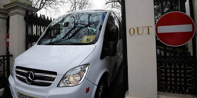A bus carrying 23 expelled diplomats and their families leaves the Russian embassy in London.