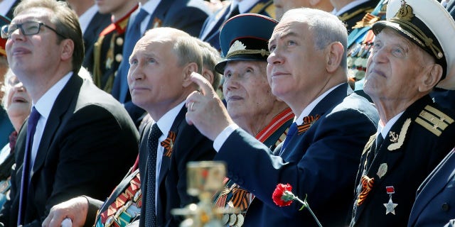 Putin and Netanyahu watch the Victory Day parade.