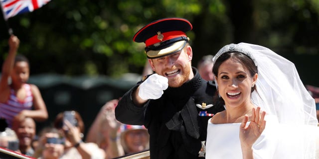 Meghan Markle and Prince Harry during the carriage procession after saying "I do."