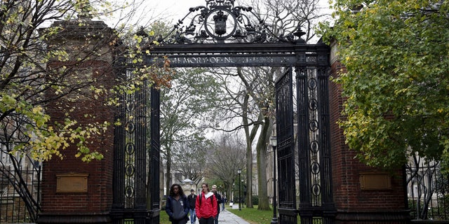 Students walk on campus of Yale University in New Haven, Connecticut.