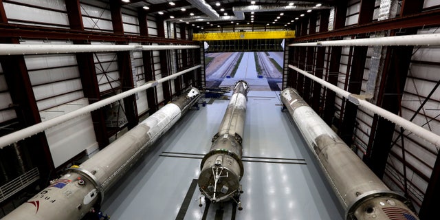 Recovered first stages of three SpaceX Falcon 9 rocket are shown during a photo opportunity in the SpaceX hangar at launch pad 39A at the Kennedy Space Center in Cape Canaveral, Florida May 14, 2016.