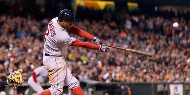 Boston Red Sox shortstop Xander Bogaerts (2) hits a two run single against the San Francisco Giants in the tenth inning at AT&T Park on Jun 7, 2016.