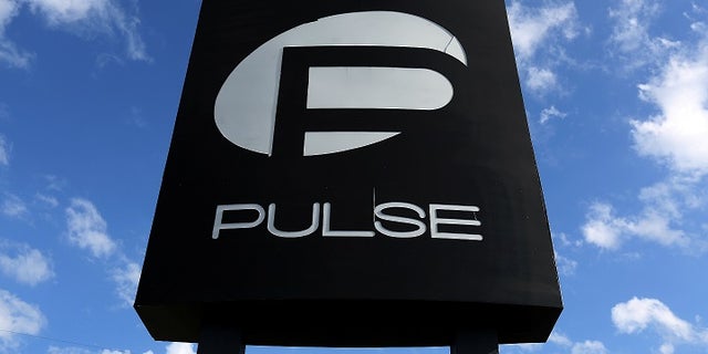 The Pulse nightclub sign was protected by workers Saturday in preparation for Hurricane Irma. The club was the site of the horrific mass shooting in June 2016.