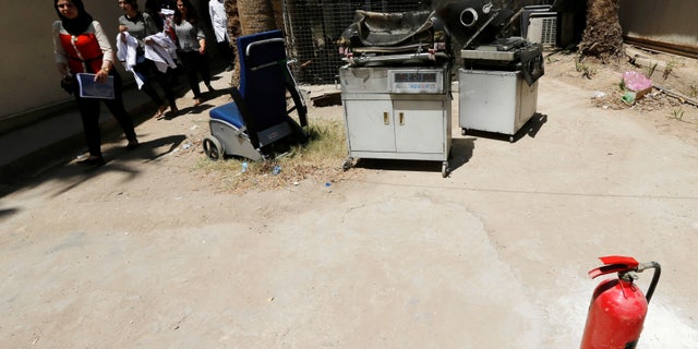 Burnt incubators outside a maternity ward after the hospital fire.