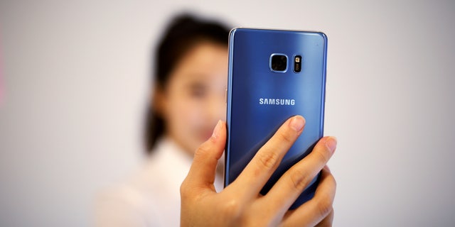 A model demonstrates iris recognition function of Galaxy Note 7 new smartphone during its launching ceremony in Seoul, South Korea, August 11, 2016.