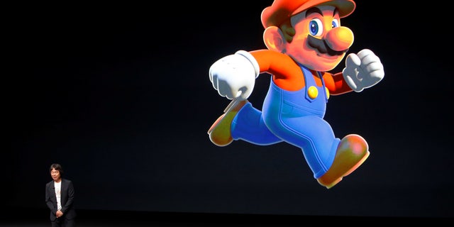 File photo: Nintendo Creative Fellow Shigeru Miyamoto stands next to the Super Mario character during an Apple media event in San Francisco, California, U.S. September 7, 2016. (REUTERS/Beck Diefenbach/File Photo)