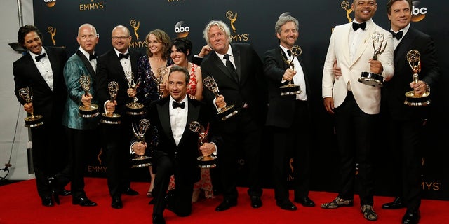 Producer Ryan Murphy (2nd L) along with cast and crew from FX Network's "The People v. O.J. Simpson: American Crime Story" pose with their award for Outstanding Limited Series at the 68th Primetime Emmy Awards in Los Angeles, California U.S., September 18, 2016. REUTERS/Mario Anzuon - RTSOCHK