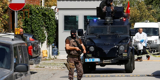 A member of police special forces stands guard in front of the Israeli Embassy in Ankara.