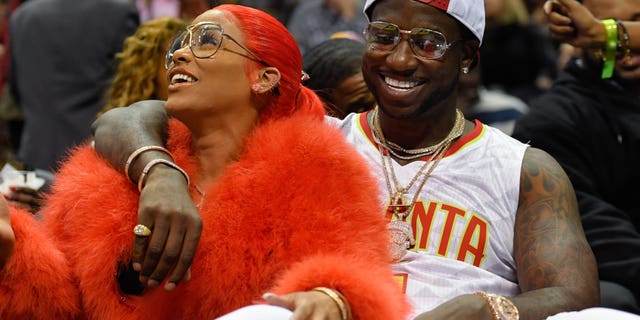 Nov 22, 2016; Atlanta, GA, USA; Recording artist Gucci Mane reacts with Keyshia Ka'oir after being engaged during a time out during the New Orleans Pelicans and Atlanta Hawks game during the second half at Philips Arena. The Pelicans defeated the Hawks 112-96.Mandatory Credit: Dale Zanine-USA TODAY Sports - RTSSVUQ