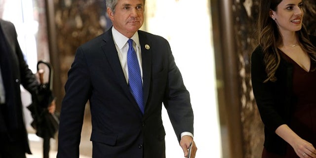U.S. Representative Michael McCaul (R-TX) is escorted by Madeleine Westerhout (R) as he arrives at Trump Tower to meet with U.S. President-elect Donald Trump in New York, U.S., November 29, 2016. REUTERS/Mike Segar - RTSTVXB