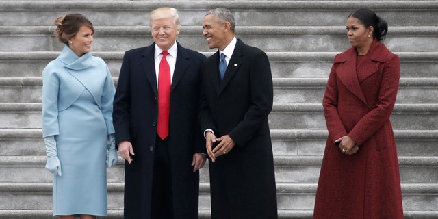 Former president Barack Obama (2nd R) and then-President Donald Trump share a laugh as former First Lady Michelle Obama (R) and Melania Trump look on following inauguration ceremonies swearing in Trump as the 45th president of the United States on the West front of the U.S. Capitol in Washington, U.S., January 20, 2017. REUTERS/Mike Segar - RTSWJBX