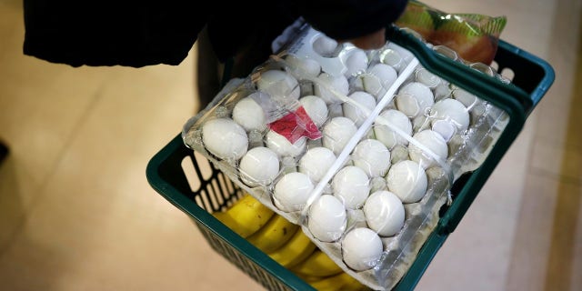 A man shops for eggs imported from the U.S., as South Korea scrambles to boost imports to relieve a shortage due to the culling of its poultry population.