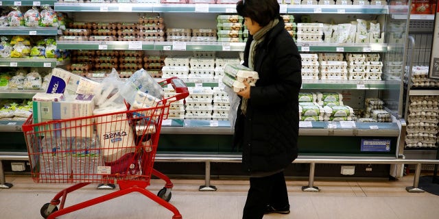 A woman shops for locally produced eggs, during a shortage of eggs as the country culled nearly a fifth of its poultry population amid its worst-ever bird flu outbreak, at a market in Seoul.