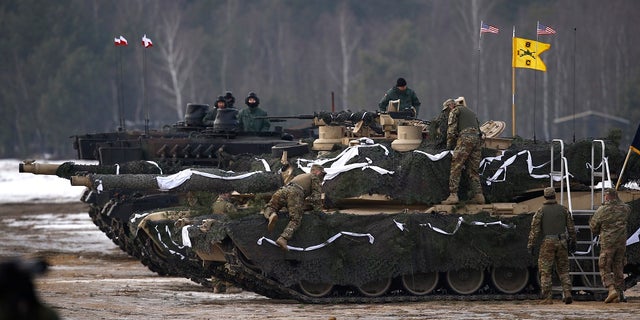 U.S. and Polish soldiers get ready for a firing exercise during the inauguration ceremony of bilateral military training between U.S. and Polish troops in Zagan, Poland, January 30, 2017.