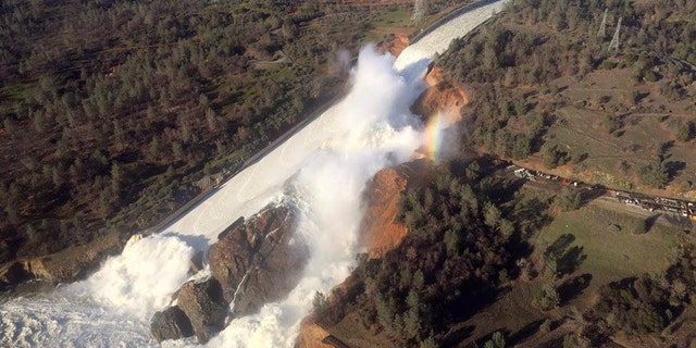 A damaged spillway with eroded hillside is seen in an aerial photo taken over the Oroville Dam in Oroville, California, U.S. February 11, 2017.