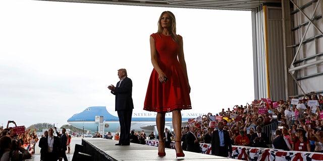 U.S. President Donald Trump and first lady Melania Trump arrive at a "Make America Great Again" rally at Orlando-Melbourne International Airport in Melbourne, Florida, U.S. February 18, 2017. REUTERS/Kevin Lamarque - RTSZBL7