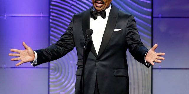 TV host Steve Harvey presents the outstanding morning program award during the 40th annual Daytime Emmy Awards in Beverly Hills, California June 16, 2013. REUTERS/Danny Moloshok (UNITED STATES - Tags: ENTERTAINMENT) - RTX10QJ3