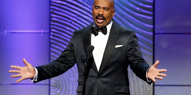 TV host Steve Harvey presents the outstanding morning program award during the 40th annual Daytime Emmy Awards in Beverly Hills, California June 16, 2013. REUTERS/Danny Moloshok (UNITED STATES - Tags: ENTERTAINMENT) - RTX10QJ3