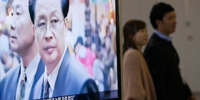 A television showed a report on Jang Song Thaek, North Korean leaders' uncle, at a railway station in Seoul December 3, 2013.