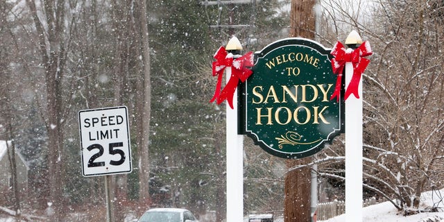 A sign welcomes visitors to Sandy Hook in Newtown, Connecticut, December 2013.