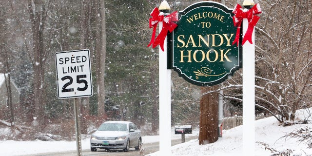 A sign welcomes visitors to Sandy Hook in Newtown, Connecticut, December 2013.