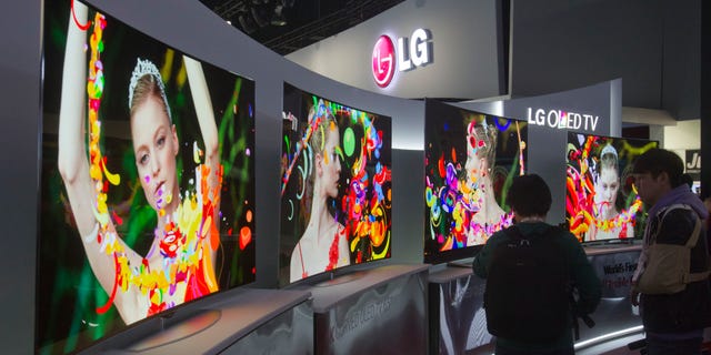 Curved 4K OLED televisions are displayed at the LG Electronics booth during the 2014 International Consumer Electronics Show at Las Vegas Convention Center in Las Vegas, Nevada.