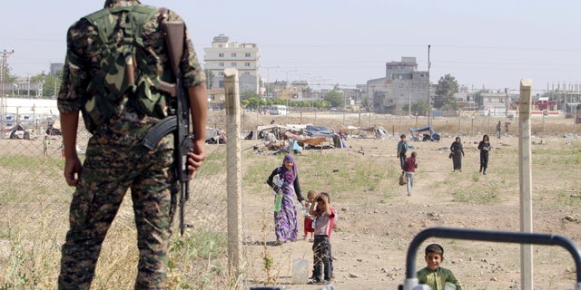 June 23, 2015: A Kurdish People's Protection Units fighter stands in Tel Abyad, Syria. (Reuters).