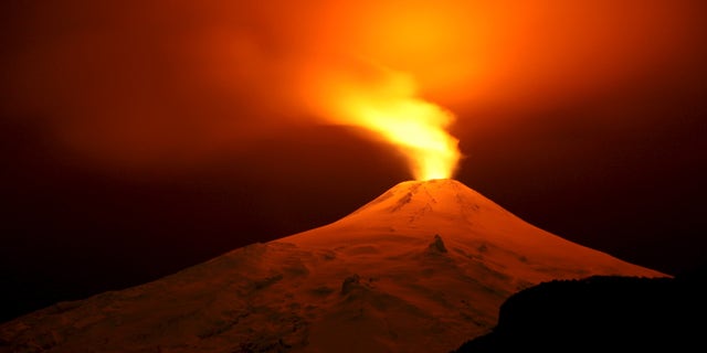 The Villarrica Volcano is seen at night from Pucon town, Chile, July 11, 2015.