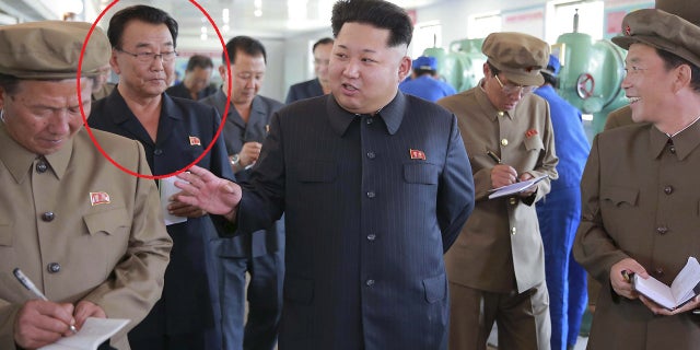 Ri Man-gon (circled) is pictured with Kim Jong Un in September 2015 at Sinuiji Measuring Instrument Factory.